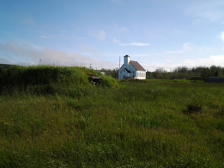 Root cellar and church in New Melbourne, NL
