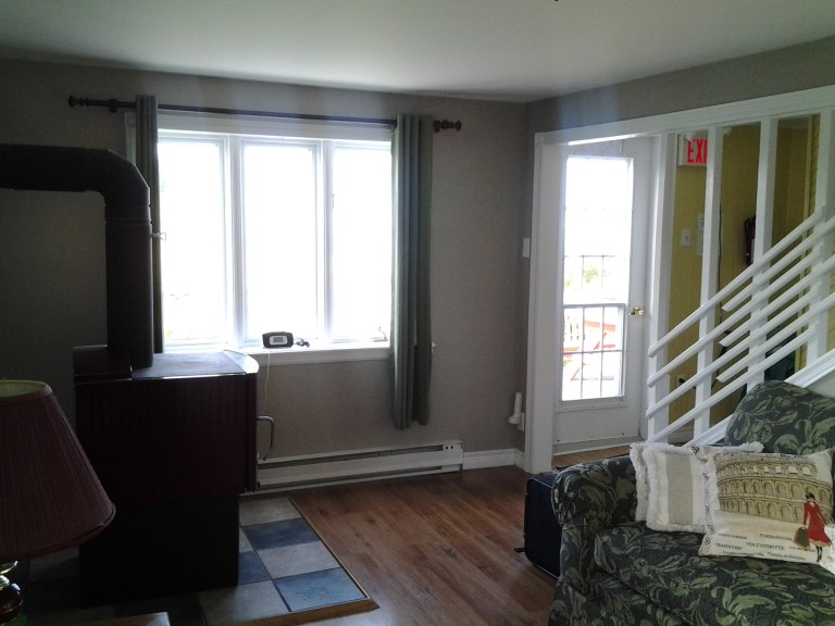 Door to deck and picnic table for whale watching.