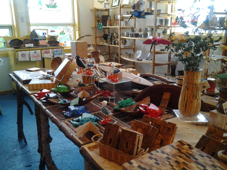 Folk art sea critters and sea birds and on the sideboard by the window, the Kings Point Pottery capelin collection. Cast pottery from capelin caught on the beach!