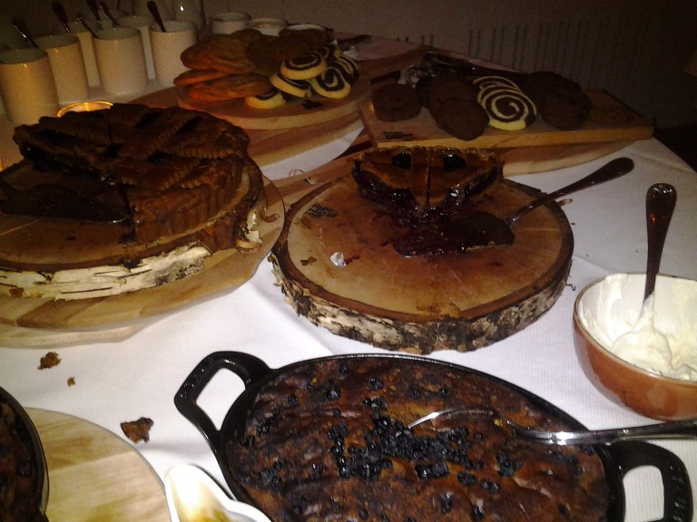 Blueberry pudding in a cast iron pot, partridgeberry pie and Kara's famous cookies, Fogo Island Inn.