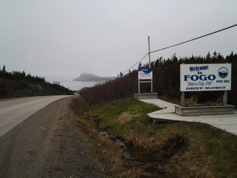 Enlarge for a hint of icebergs at the base of Brimstone Head, Fogo, NL