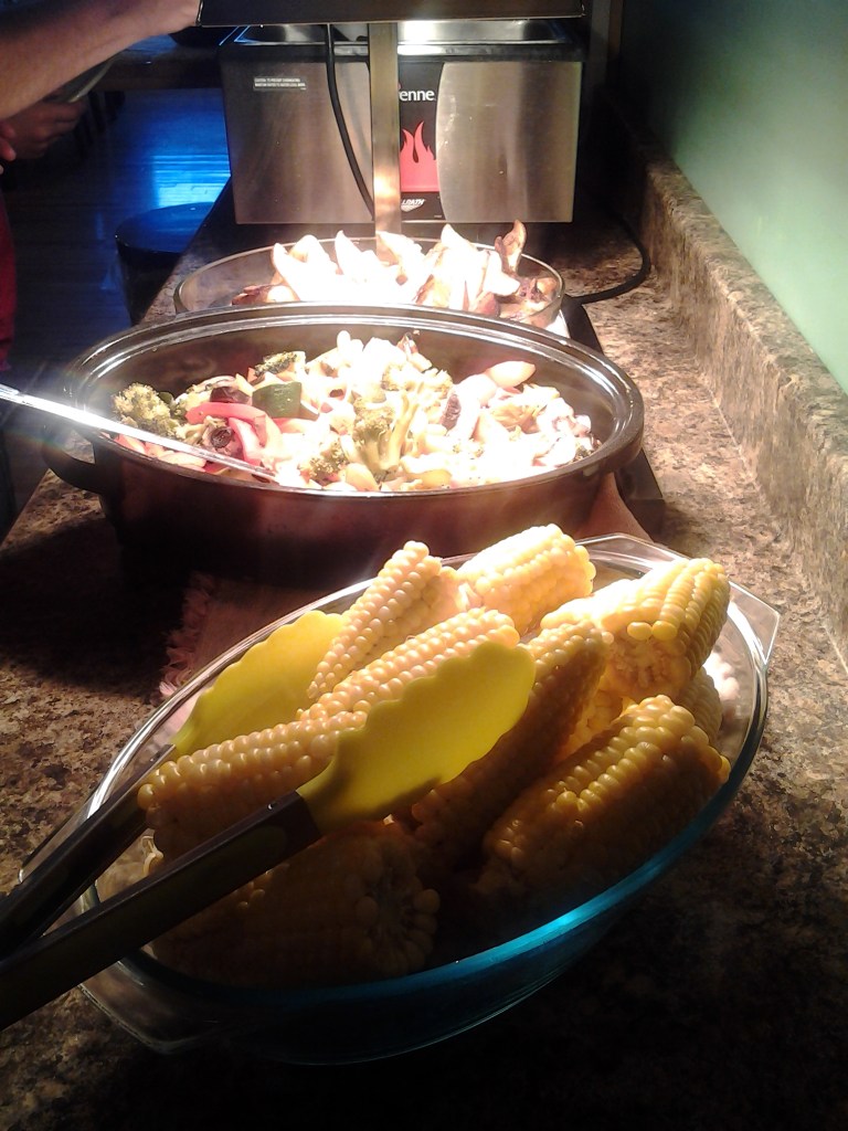 Fresh corn and other dishes on buffet at Inn at the Cape