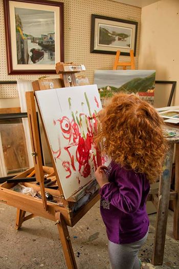 Jeff Musseau shares painting time and technique with his granddaughter.